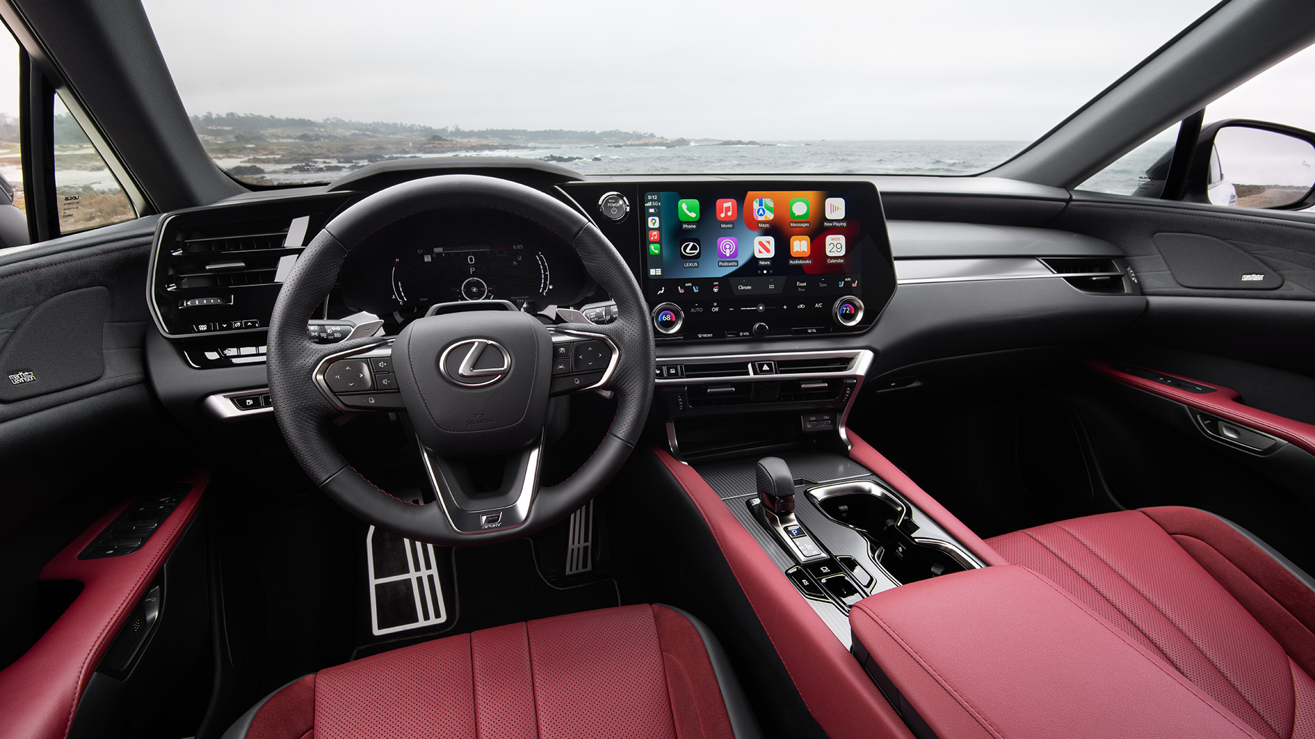 The interior of the RX showing off the red seats and trim, as well as the steering wheel, controls and touchscreen.